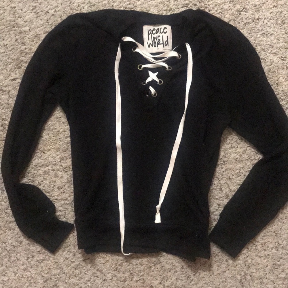 Peace Love World sweatshirt in black.